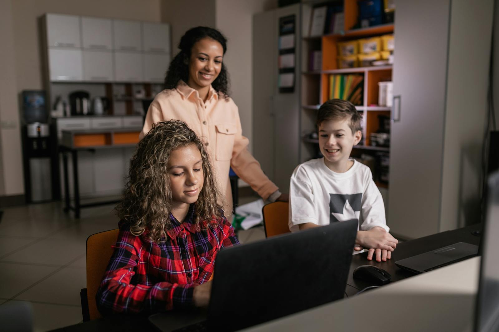 Children using a laptop together
