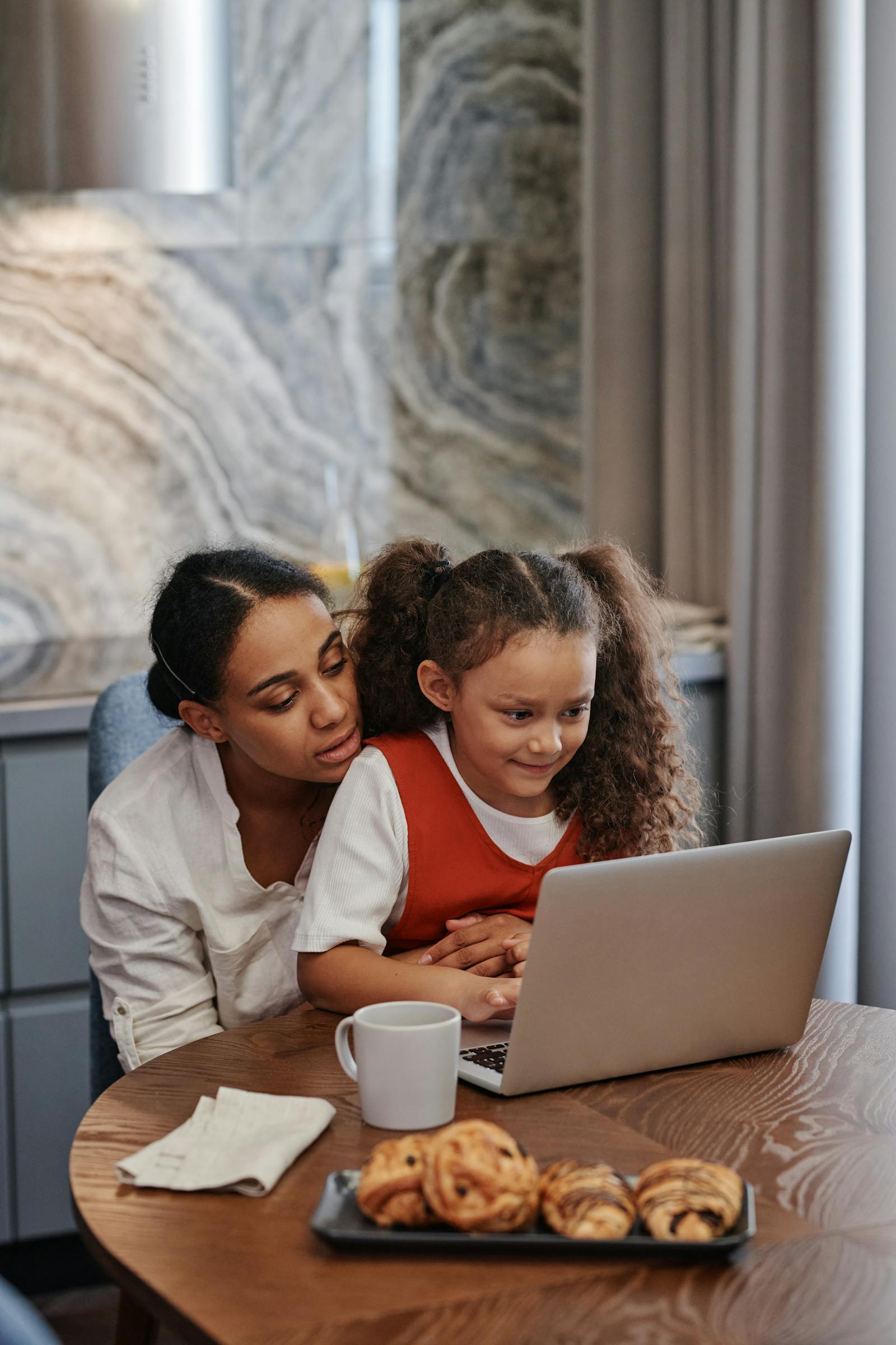 A parent and child checking the SchoolBench Pro parent portal together